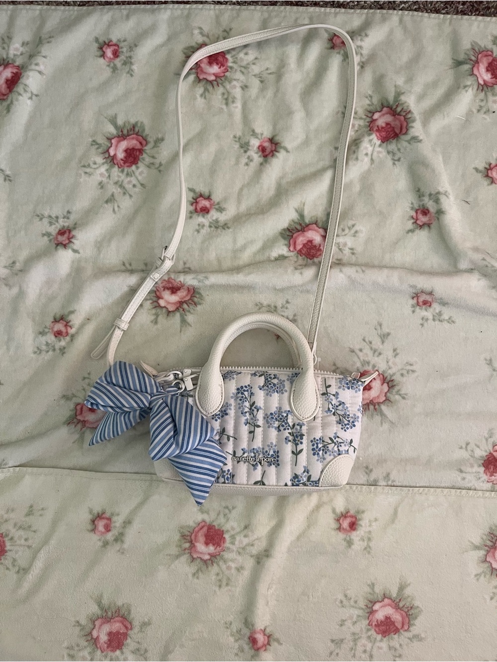 Nanette Lepore White Mini Floral Crossbody with Blue Bow Accent